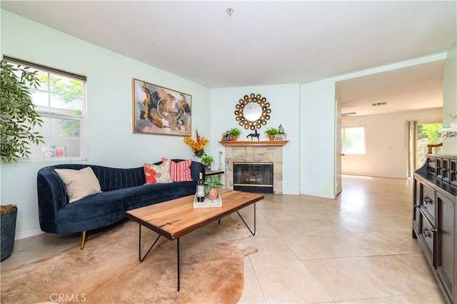 530 Diamond St Unit C, Monrovia, CA 91016 - living area with a stone fireplace and light tile patterned flooring