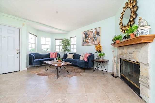530 Diamond St Unit C, Monrovia, CA 91016 - living room with a stone fireplace, light tile patterned flooring, and baseboards