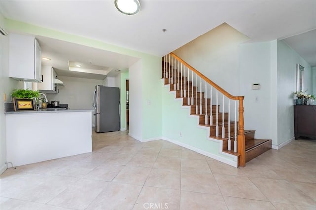 530 Diamond St Unit C, Monrovia, CA 91016 - kitchen with freestanding refrigerator, white cabinetry, light tile patterned flooring, and a tray ceiling