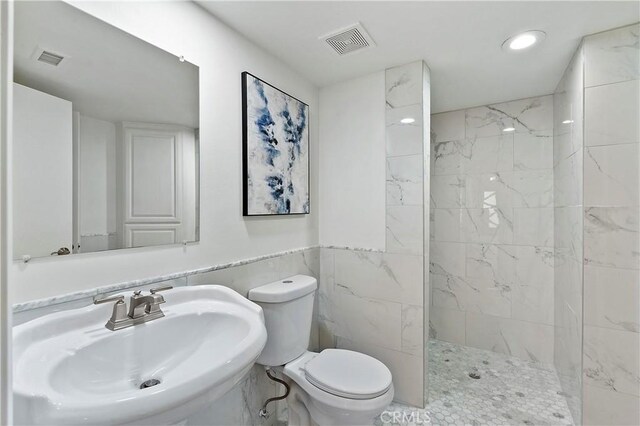 30346 Via Reata, Laguna Niguel, CA 92677 - full bathroom featuring a sink, toilet, a marble finish shower, recessed lighting, and tile walls