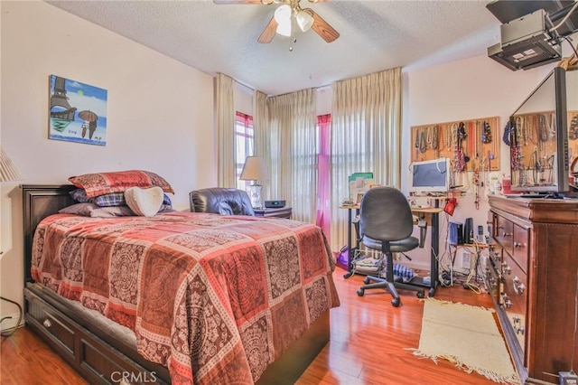 14012 S Wilkie Ave, Gardena, CA 90249 - bedroom featuring wood finished floors, an office area, and a textured ceiling