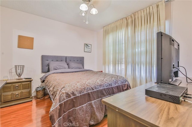 14012 S Wilkie Ave, Gardena, CA 90249 - bedroom with multiple windows, light wood finished floors, and ceiling fan