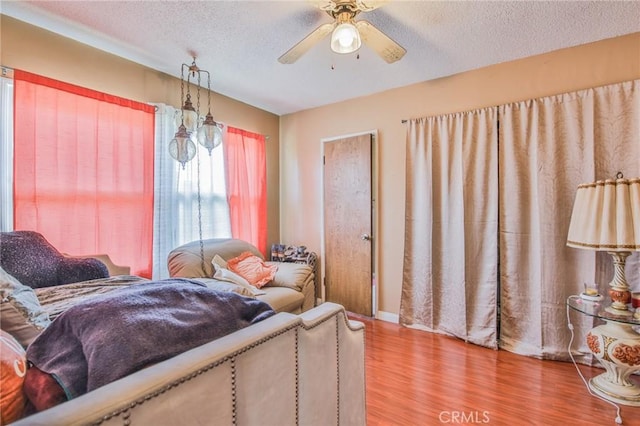 14012 S Wilkie Ave, Gardena, CA 90249 - bedroom featuring wood finished floors, a textured ceiling, and a ceiling fan