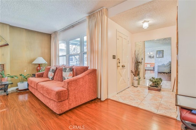 14012 S Wilkie Ave, Gardena, CA 90249 - living area with a textured ceiling, wood finished floors, and arched walkways