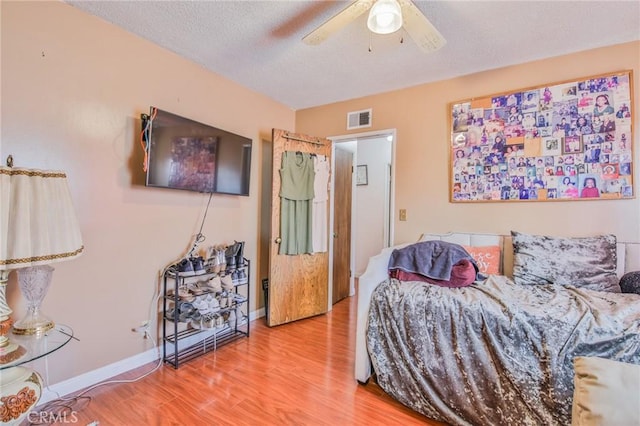 14012 S Wilkie Ave, Gardena, CA 90249 - bedroom featuring wood finished floors, a textured ceiling, and a ceiling fan
