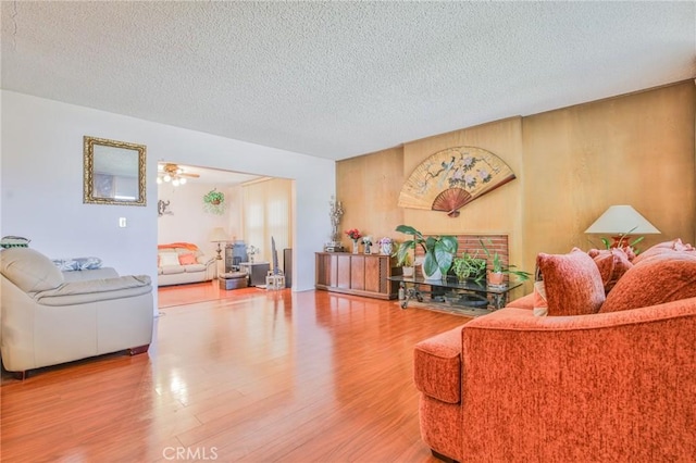14012 S Wilkie Ave, Gardena, CA 90249 - living area featuring wood finished floors, a textured ceiling, and ceiling fan