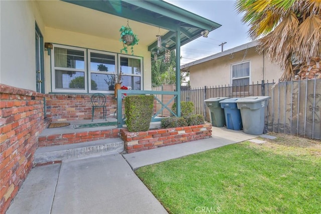 14012 S Wilkie Ave, Gardena, CA 90249 - doorway to property featuring covered porch and stucco siding