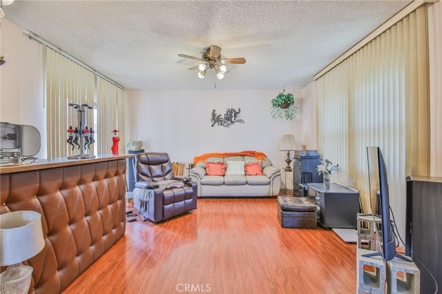 14012 S Wilkie Ave, Gardena, CA 90249 - living area with wood finished floors, ceiling fan, and a textured ceiling