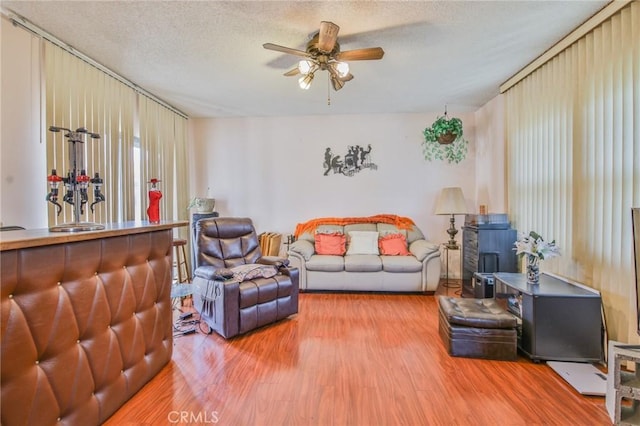 14012 S Wilkie Ave, Gardena, CA 90249 - living area featuring ceiling fan, wood finished floors, and a textured ceiling