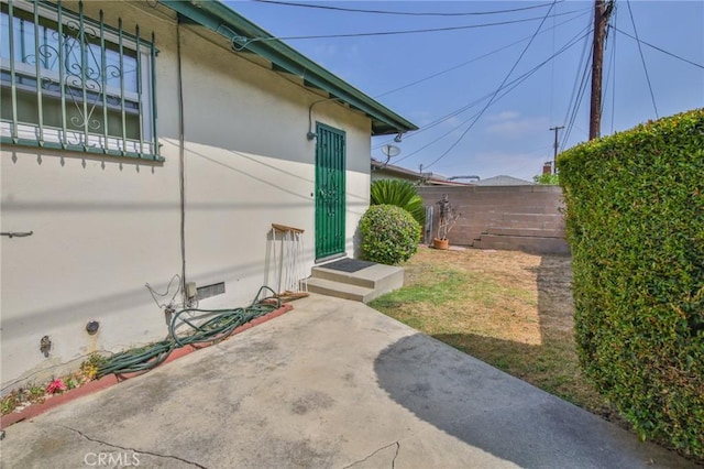 14012 S Wilkie Ave, Gardena, CA 90249 - view of side of property featuring stucco siding and a patio area