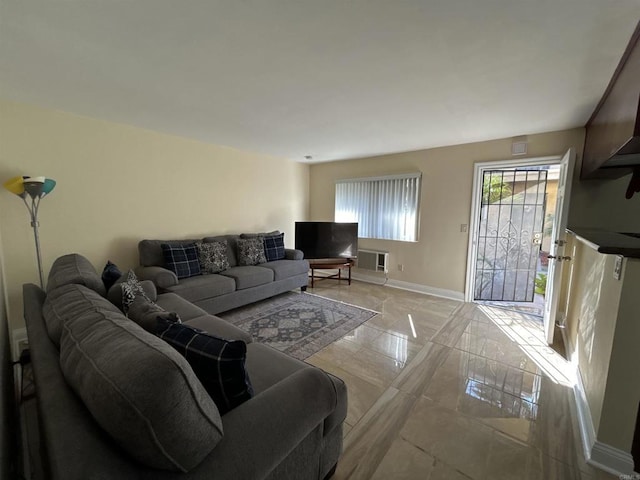 12805 Mapleview St Unit 14, Lakeside, CA 92040 - living area with baseboards, light marble finish floors, and an AC wall unit