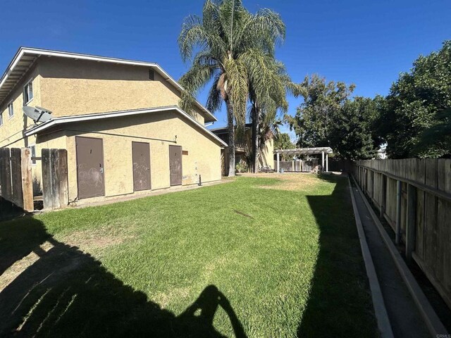 12805 Mapleview St Unit 14, Lakeside, CA 92040 - rear view of property featuring stucco siding and a pergola