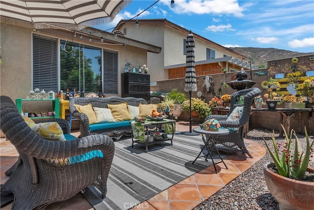 11244 Sega Ln, Fontana, CA 92337 - view of patio / terrace with outdoor lounge area and a mountain view