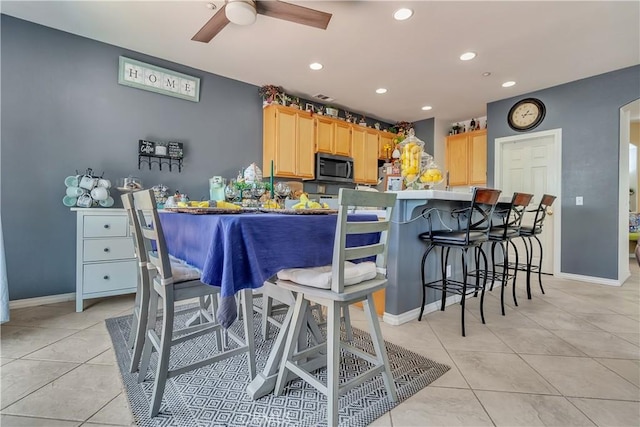 11244 Sega Ln, Fontana, CA 92337 - kitchen with light brown cabinetry, light tile patterned flooring, a ceiling fan, recessed lighting, and a peninsula