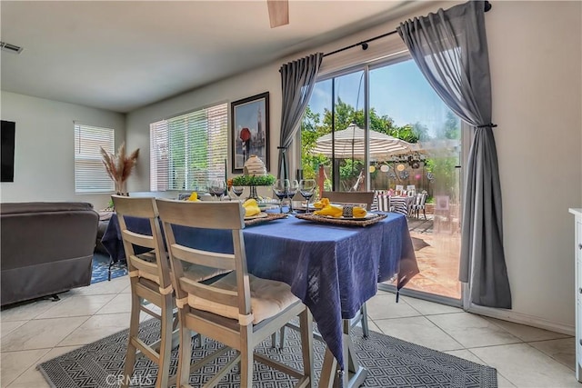11244 Sega Ln, Fontana, CA 92337 - dining area featuring light tile patterned floors