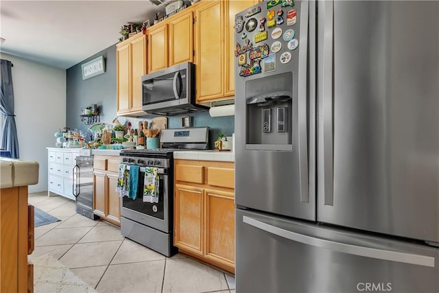 11244 Sega Ln, Fontana, CA 92337 - kitchen with appliances with stainless steel finishes, tile counters, beverage cooler, light tile patterned floors, and light brown cabinetry