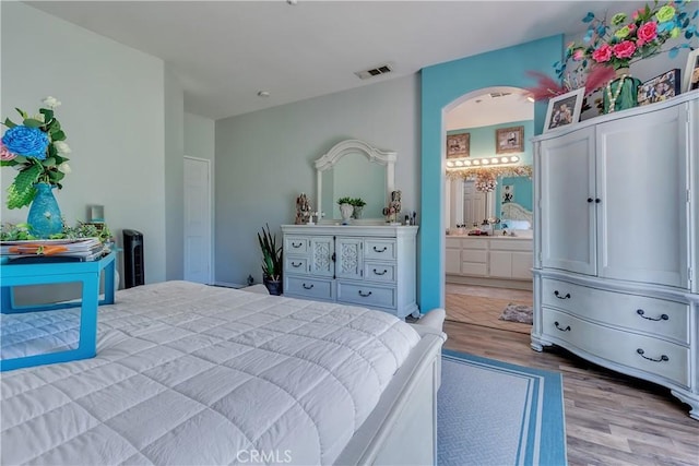 11244 Sega Ln, Fontana, CA 92337 - bedroom with wood finished floors and ensuite bath