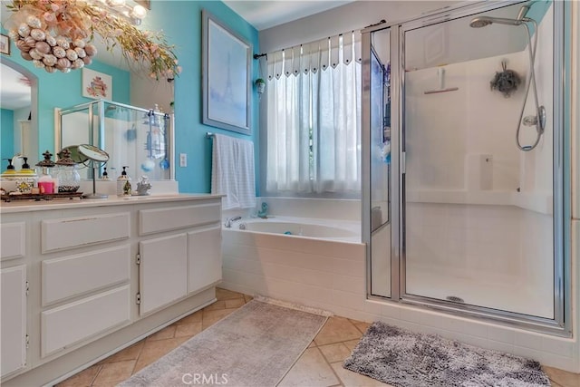 11244 Sega Ln, Fontana, CA 92337 - bathroom featuring vanity, a stall shower, a garden tub, and tile patterned flooring