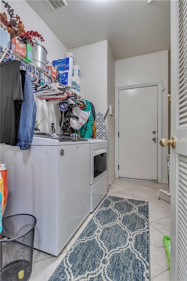 11244 Sega Ln, Fontana, CA 92337 - washroom featuring independent washer and dryer and light tile patterned flooring