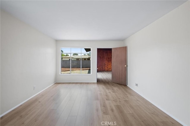 150 E 232nd St, Carson, CA 90745 - spare room featuring light wood-style flooring and baseboards