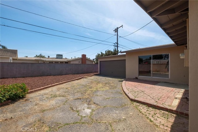 150 E 232nd St, Carson, CA 90745 - view of yard with a detached garage and a patio area