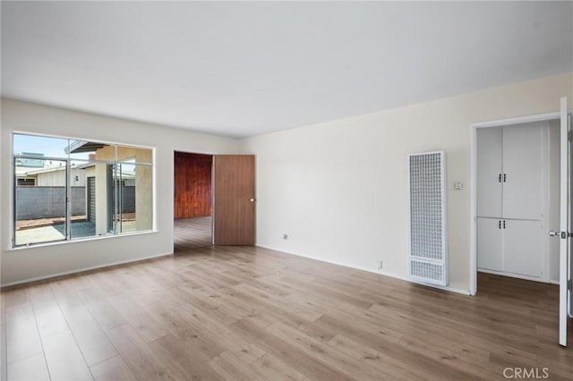 150 E 232nd St, Carson, CA 90745 - unfurnished room with a heating unit and wood finished floors