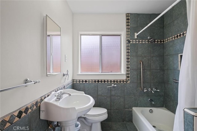 150 E 232nd St, Carson, CA 90745 - bathroom featuring shower / bathtub combination with curtain, tile walls, tile patterned flooring, and wainscoting