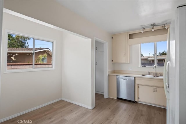 150 E 232nd St, Carson, CA 90745 - kitchen with stainless steel dishwasher, healthy amount of natural light, light wood-style floors, and light countertops