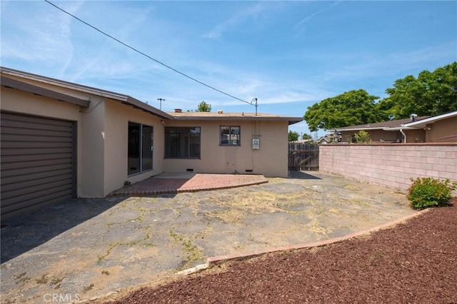150 E 232nd St, Carson, CA 90745 - rear view of property with stucco siding and a patio area
