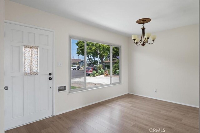 150 E 232nd St, Carson, CA 90745 - entrance foyer featuring a chandelier and wood finished floors