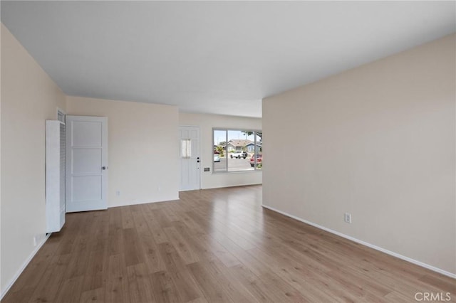 150 E 232nd St, Carson, CA 90745 - unfurnished living room featuring wood finished floors and a heating unit