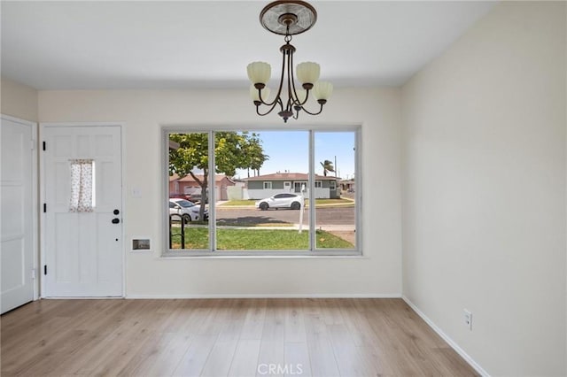 150 E 232nd St, Carson, CA 90745 - unfurnished dining area with a chandelier and wood finished floors