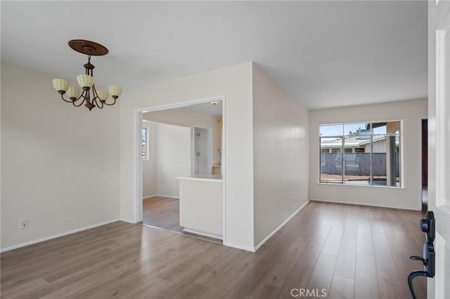 150 E 232nd St, Carson, CA 90745 - unfurnished dining area featuring a chandelier and wood finished floors