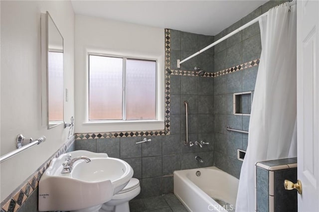 150 E 232nd St, Carson, CA 90745 - bathroom with shower / tub combo, tile walls, and tile patterned floors