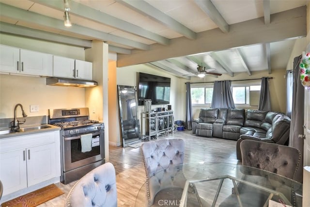 26737 Cypress St, Highland, CA 92346 - living area featuring light wood-style floors, ceiling fan, and baseboards