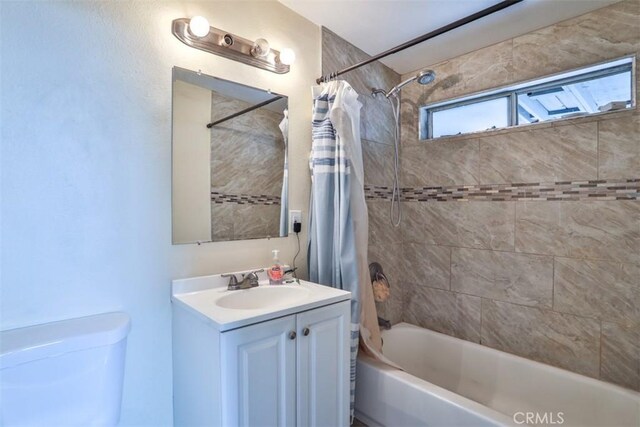 26737 Cypress St, Highland, CA 92346 - bathroom with shower / bath combination with curtain, vanity, and toilet
