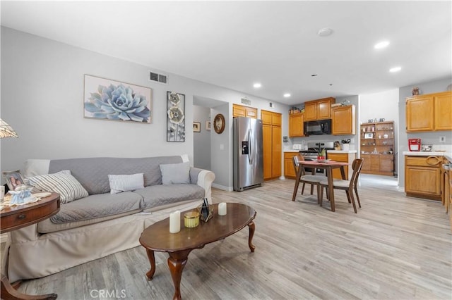 13519 Fremont St, Fontana, CA 92336 - living room with light wood-style floors and recessed lighting
