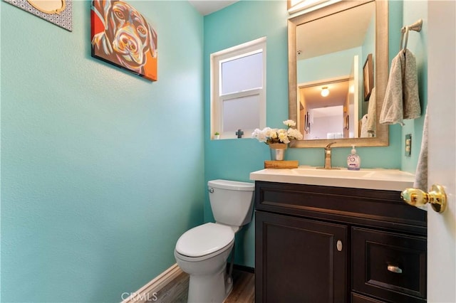 13519 Fremont St, Fontana, CA 92336 - half bathroom featuring vanity and wood finished floors