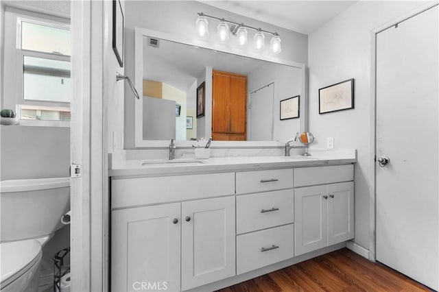 13519 Fremont St, Fontana, CA 92336 - full bathroom with double vanity and wood finished floors