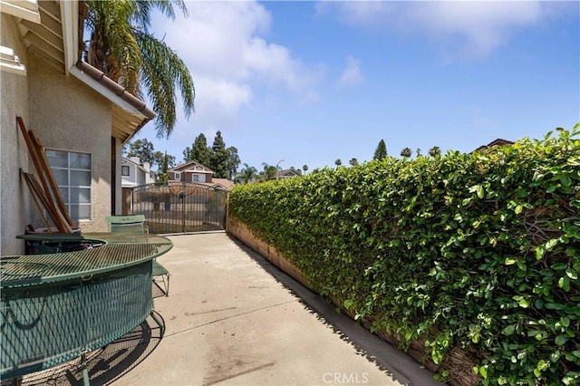 13519 Fremont St, Fontana, CA 92336 - view of patio / terrace featuring a gate