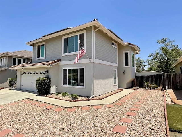 1917 Tecate, Escondido, CA 92029 - view of front facade with concrete driveway, a garage, and stucco siding
