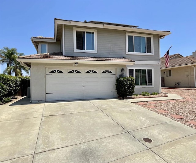 1917 Tecate, Escondido, CA 92029 - traditional-style house featuring an attached garage, stucco siding, and driveway