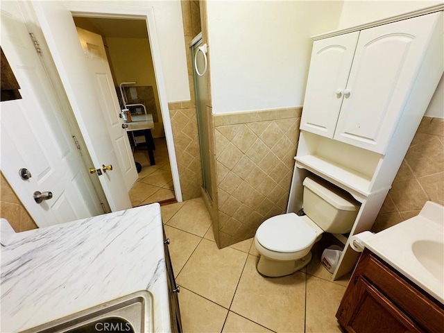 14542 Los Robles Ave, Hacienda Heights, CA 91745 - bathroom with tile walls, wainscoting, vanity, a stall shower, and tile patterned flooring