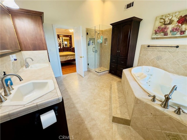 14542 Los Robles Ave, Hacienda Heights, CA 91745 - full bathroom featuring a shower stall, double vanity, a tub with jets, tile patterned floors, and ensuite bath
