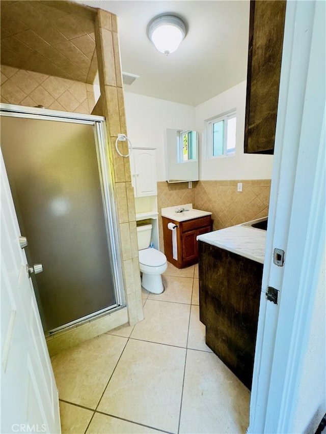 14542 Los Robles Ave, Hacienda Heights, CA 91745 - full bathroom featuring vanity, tile walls, tile patterned floors, and a shower stall