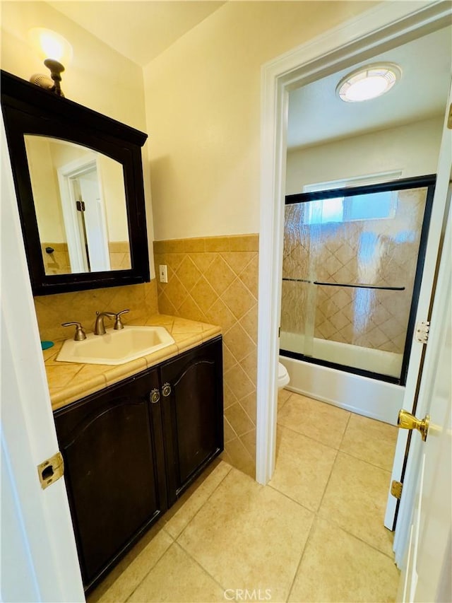 14542 Los Robles Ave, Hacienda Heights, CA 91745 - bathroom featuring tile walls, vanity, wainscoting, shower / washtub combination, and tile patterned floors
