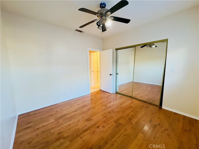 14542 Los Robles Ave, Hacienda Heights, CA 91745 - unfurnished bedroom with wood finished floors, a closet, and a ceiling fan
