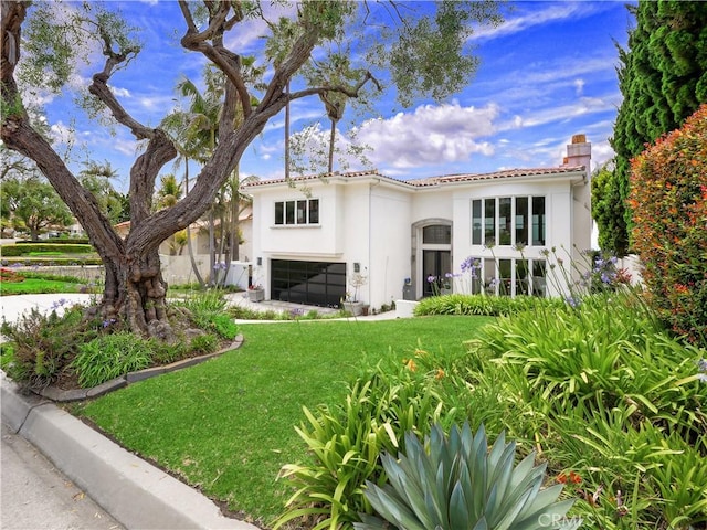 2637 Via Olivera, Palos Verdes Estates, CA 90274 - rear view of house with an attached garage, stucco siding, a yard, a chimney, and a tile roof