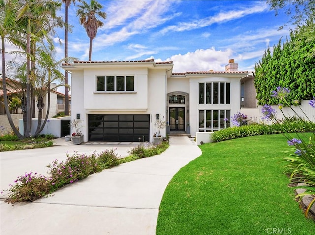 2637 Via Olivera, Palos Verdes Estates, CA 90274 - mediterranean / spanish-style house featuring french doors, stucco siding, a garage, a chimney, and concrete driveway