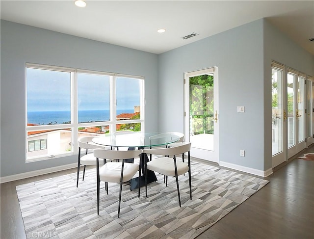 2637 Via Olivera, Palos Verdes Estates, CA 90274 - dining area with healthy amount of natural light, baseboards, recessed lighting, a water view, and wood finished floors